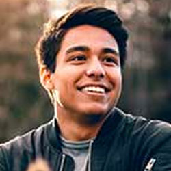 Functional Therapeutics Swfl - A man enjoys therapeutic massage while sitting in a field.